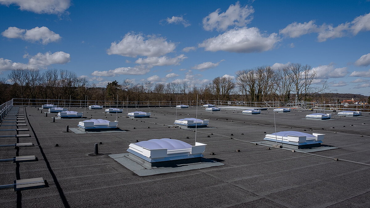 Three skylight domes on the flat roof of the R-Pharm building in Illertissen.