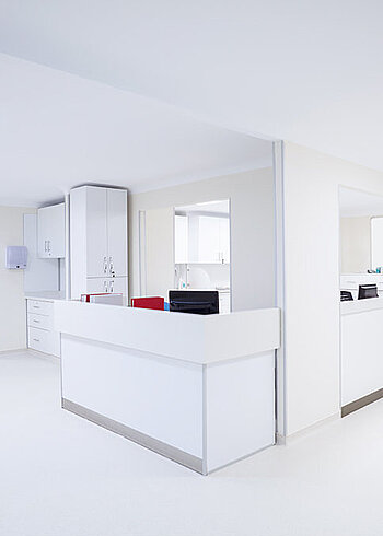  Modern, white reception area in an office.