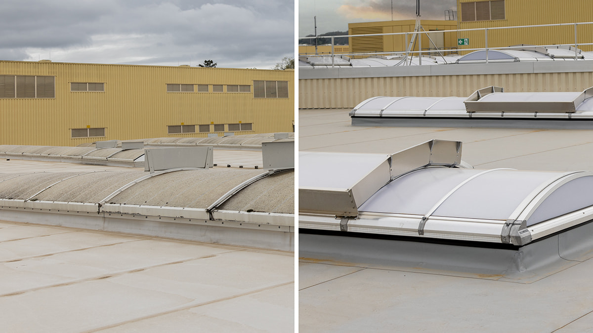 Comparison of an old and new roof skylight on a flat roof with a yellow building in the background.
