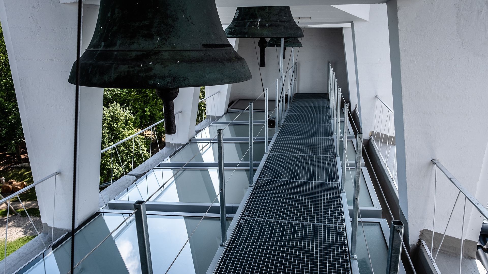 Bell tower of St Paul's Church in Traunreut with LAMILUX FE flat roof windows.