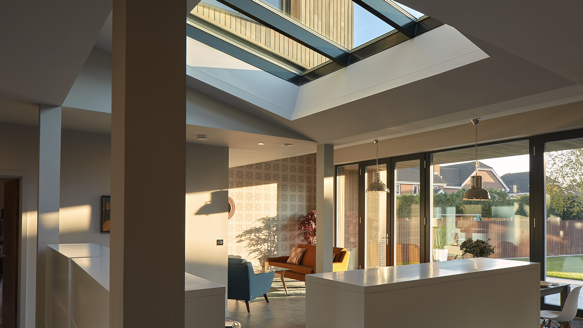 Interior of Potton Show Homes in England featuring a LAMILUX PR60 glass roof, bringing natural light into the modern living space.