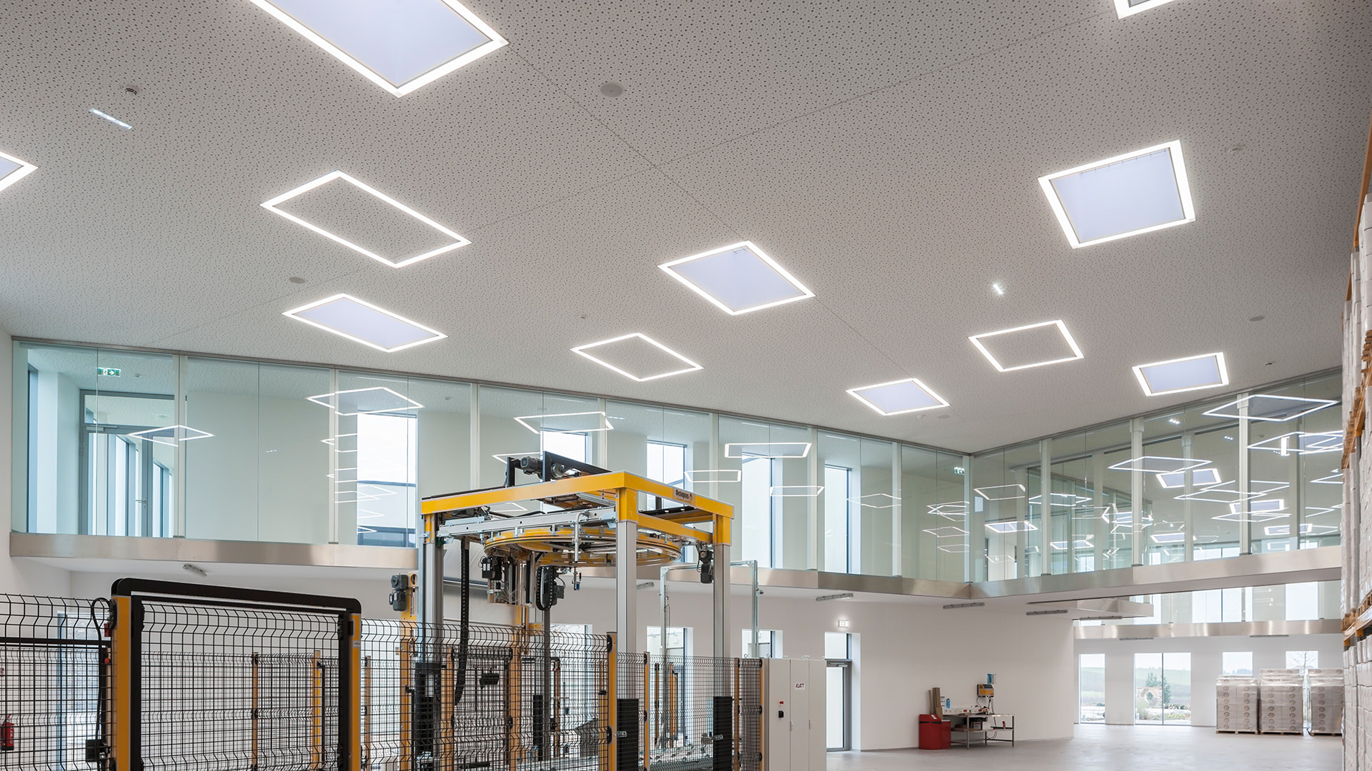 Exterior view of the roof of the Zaltech building in Moosdorf, Austria, with LAMILUX F100 flat roof windows and FE round flat roof windows.